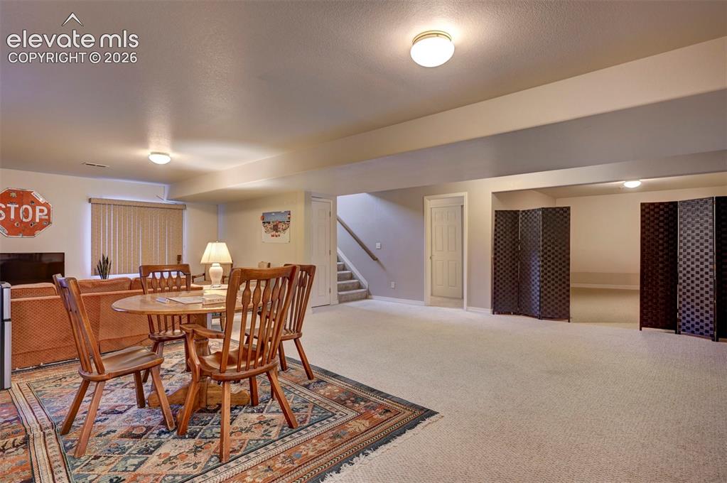 Image 34 of 50: Family Room with additional area for  home gym.