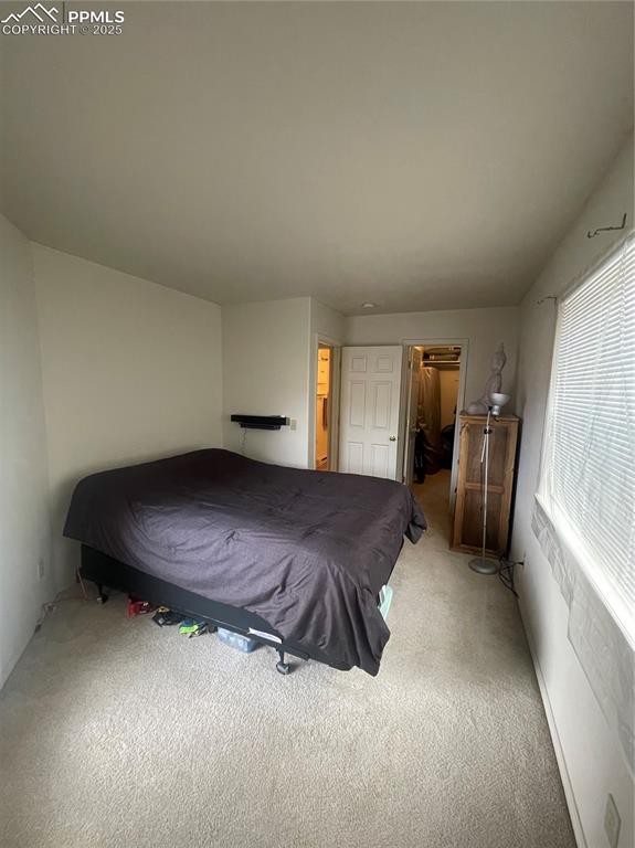 Image 14 of 24: Unfurnished bedroom with carpet floors and billiards