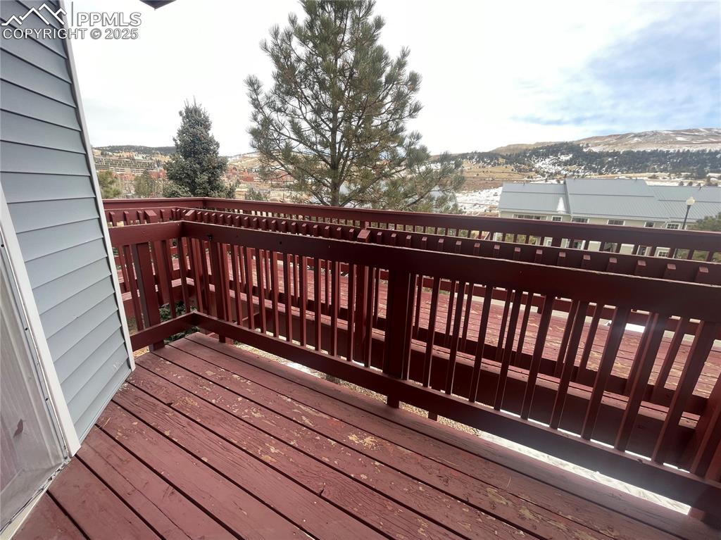 Image 16 of 24: Wooden terrace featuring a mountain view