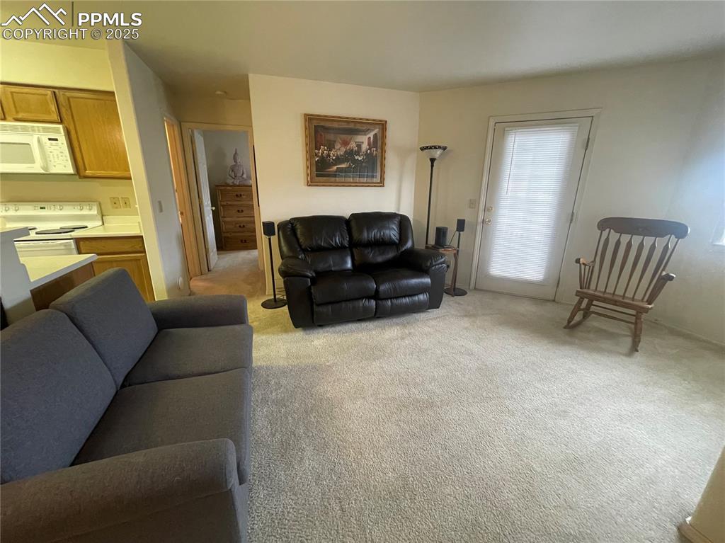 Image 5 of 24: View of carpeted living room