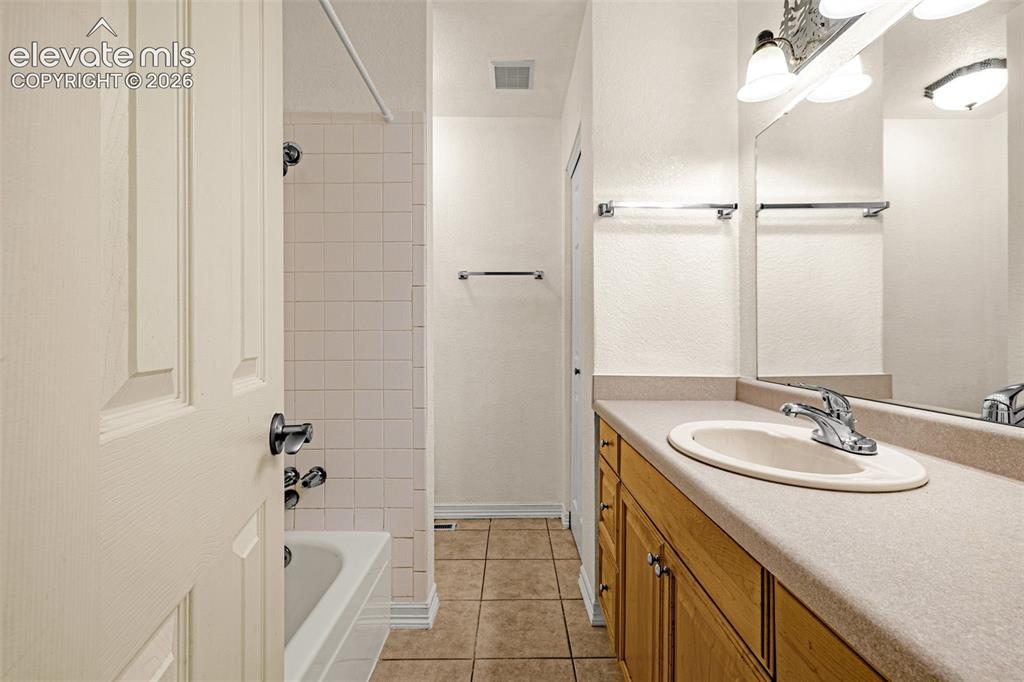 Image 22 of 48: Hall Bath