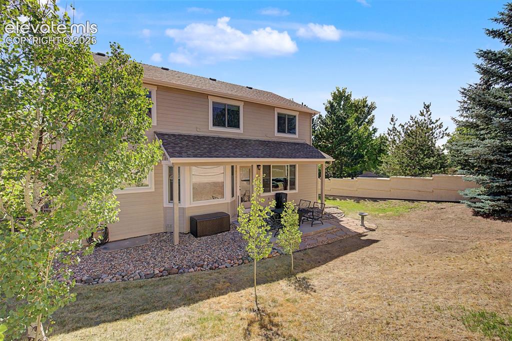 Image 30 of 37: Please note: The camera angle flattens the appearance of the backyard, maki