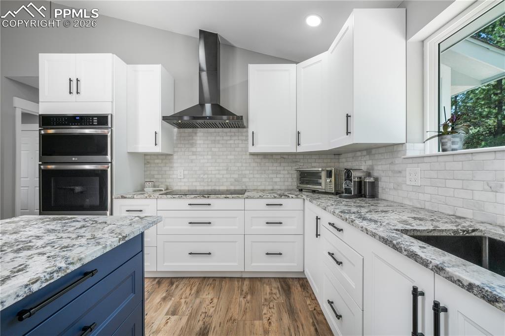 Image 16 of 50: Remodeled kitchen, granite counters, updated appliances to include inductio