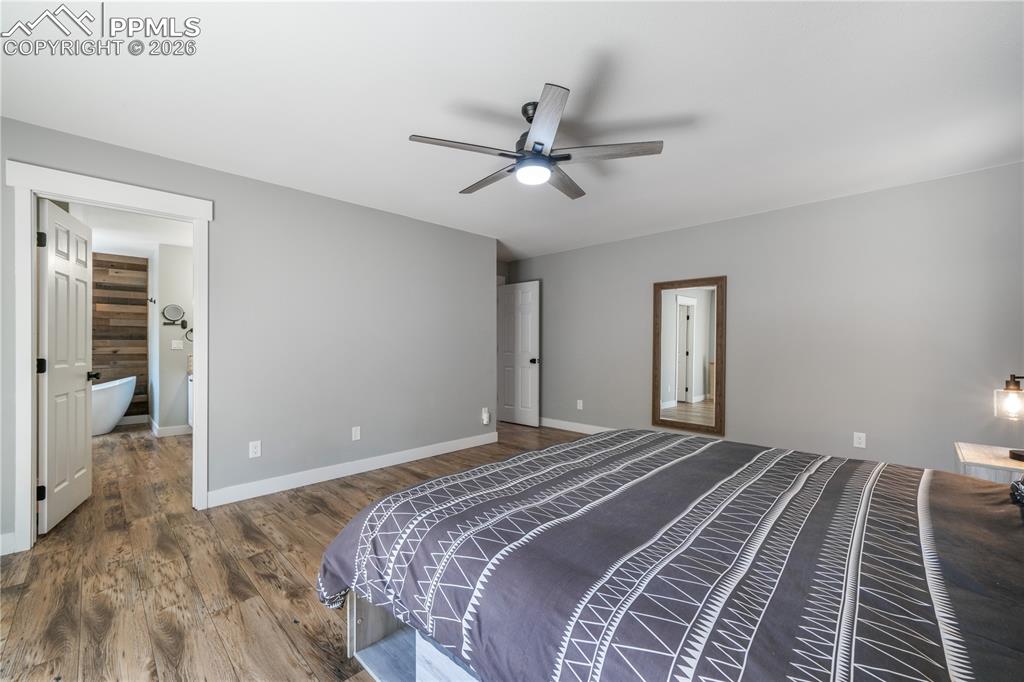 Image 21 of 50: Primary bedroom, ensuite 5 piece bath, private patio, custom walk in closet