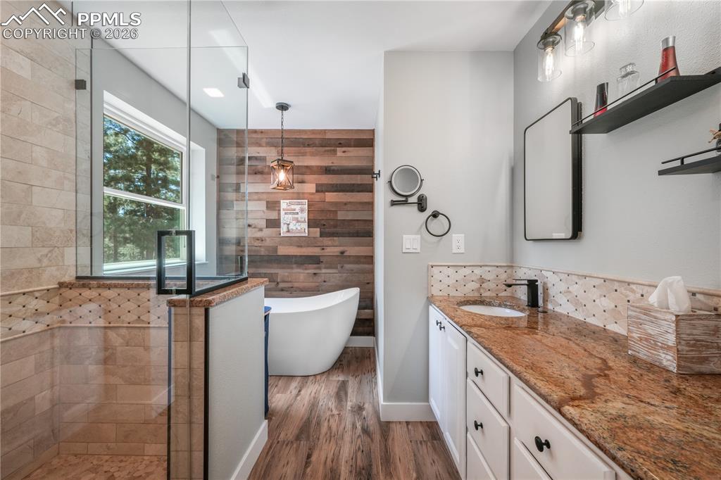Image 23 of 50: Primary ensuite 5 piece bath with custom walk in closet