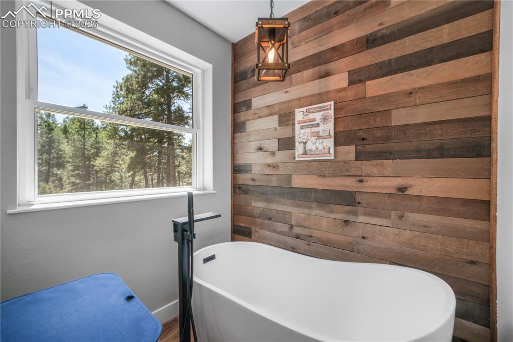 Image 24 of 50: Primary ensuite 5 piece bath with custom walk in closet