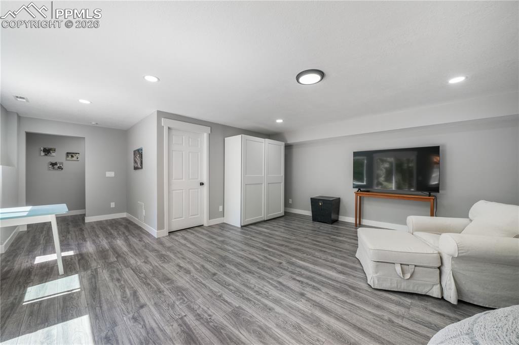 Image 32 of 50: Basement family room with walk out access to patio