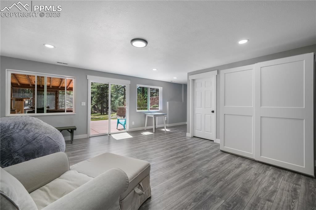 Image 33 of 50: Basement family room with walk out access to patio