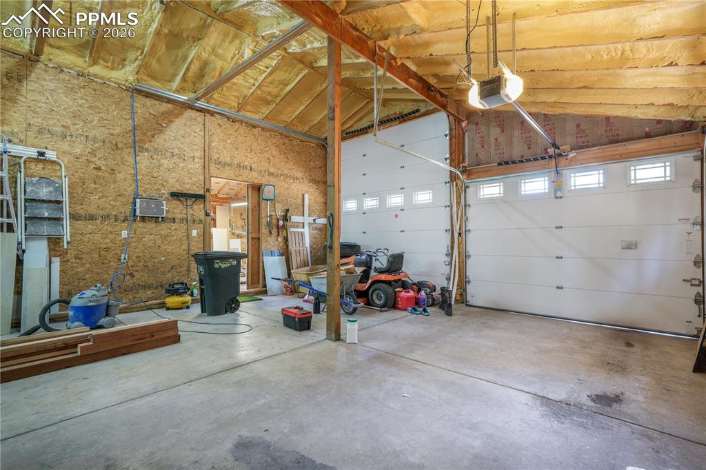 Image 40 of 50: Detached garage with workshop and RV parking, 50 amp access