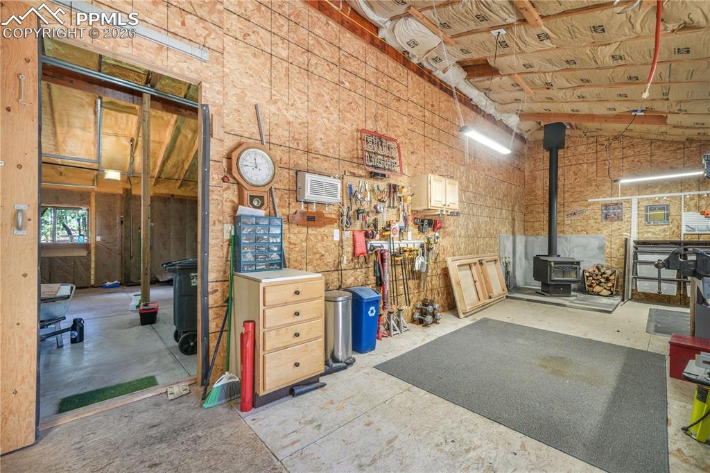 Image 41 of 50: Detached garage with workshop and RV 