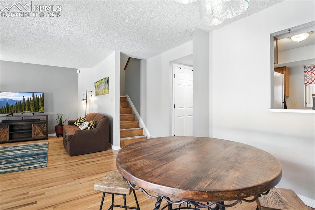 Image 12 of 25: Kitchen is light and bright with a lovely view of the plum tree in the fron