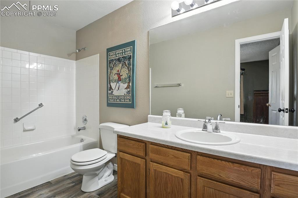 Image 20 of 25: Secondary bathroom on upper level, private for second bedroom with shower b