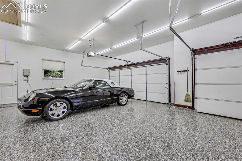 Image 21 of 48: NOT FOR SALE-Thunderbird! Attic storage and door to side yard.