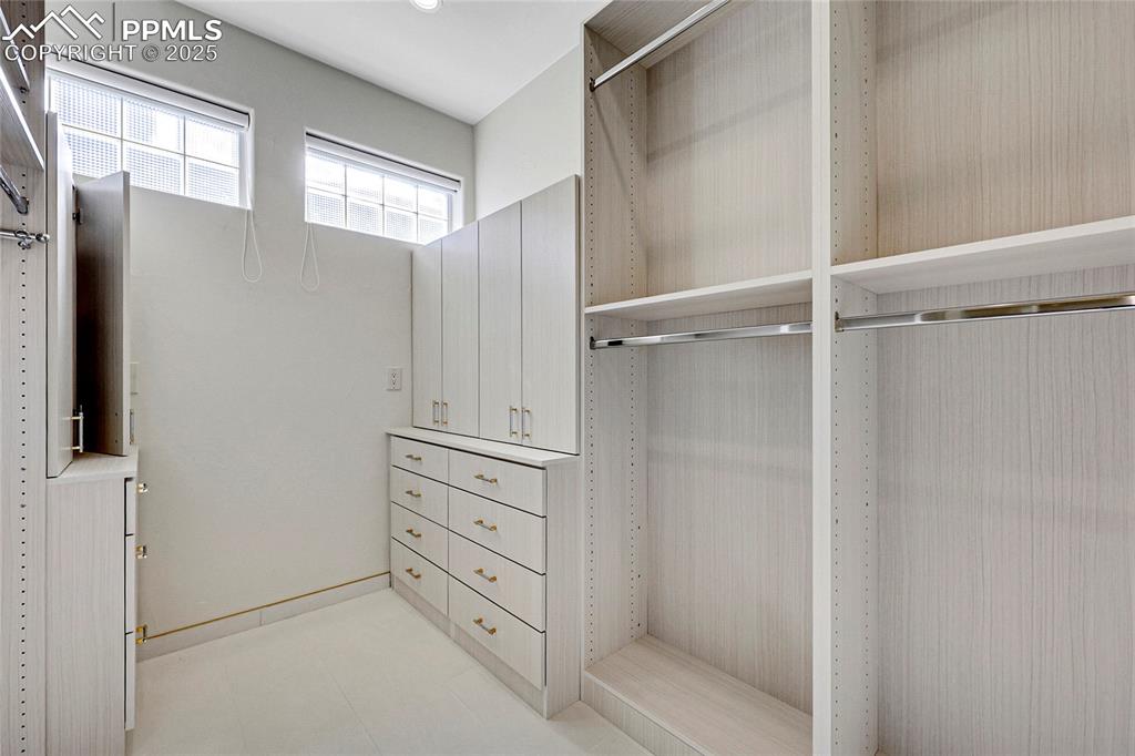 Image 31 of 48: 2nd Large walk-in closet w/custom shelving
