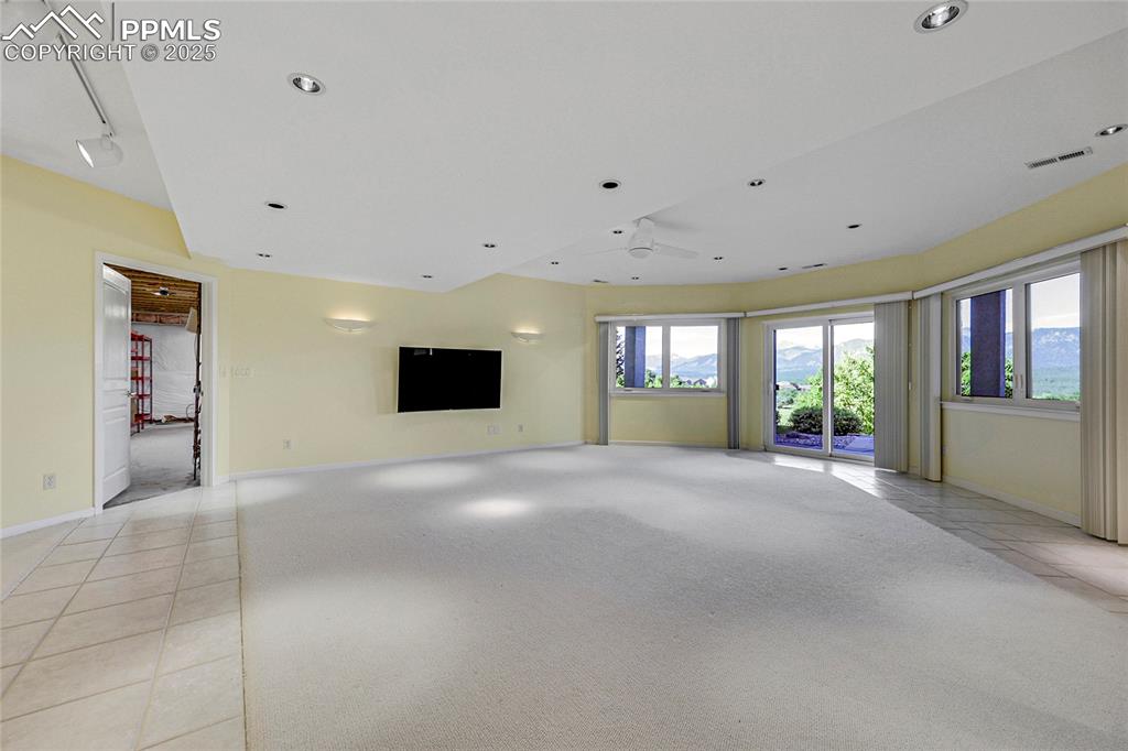 Image 34 of 48: Unfurnished living room featuring recessed lighting and ceiling fan