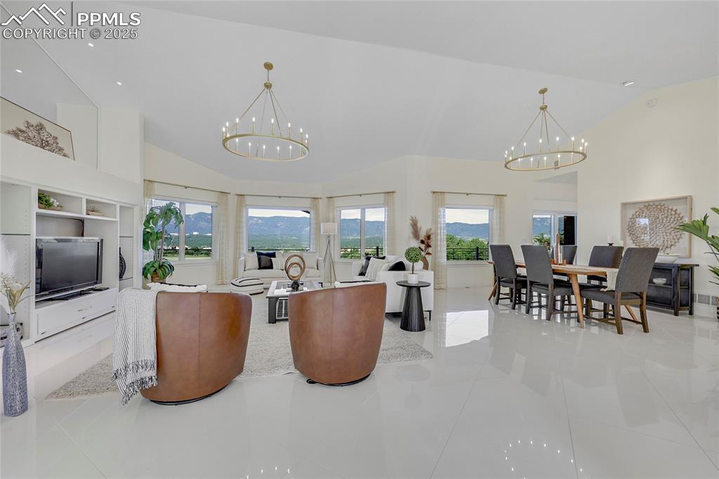 Image 4 of 48: Dramatic Great Room with vaulted ceilings