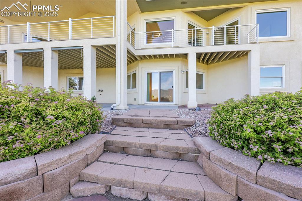 Image 44 of 48: Property entrance featuring stucco siding