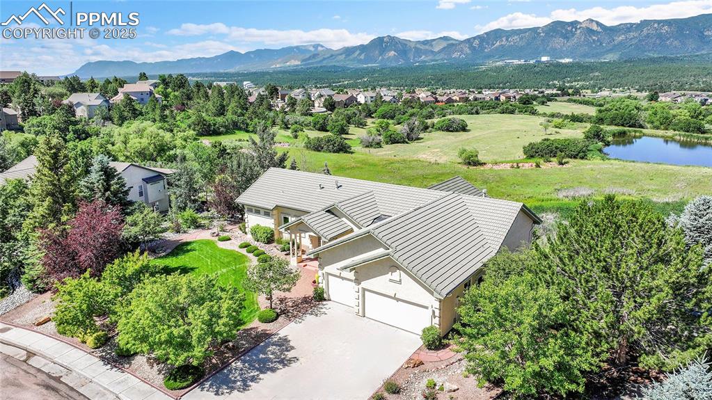 Image 48 of 48: Aerial view of residential area with a water and mountain view