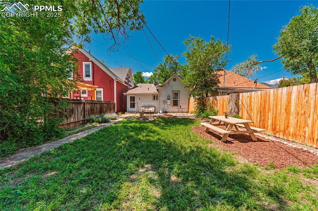 Image 2 of 36: Fenced backyard featuring a patio