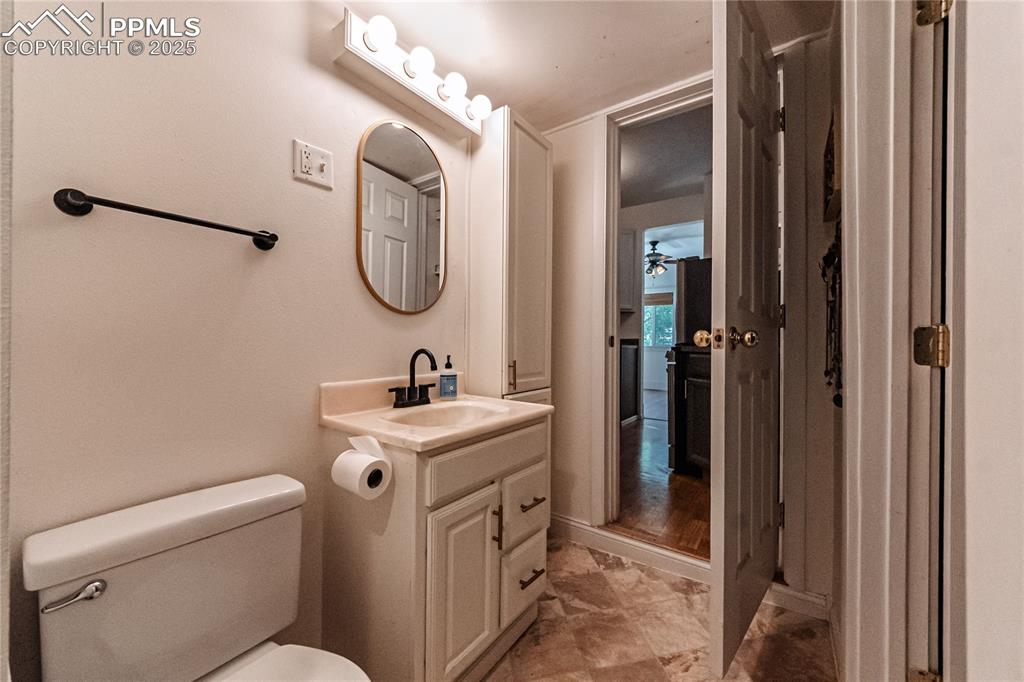 Image 22 of 36: Bathroom with vanity and ceiling fan