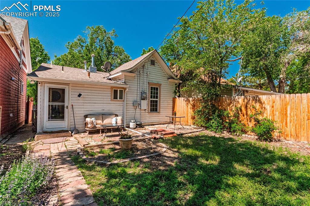Image 3 of 36: Back of property with a patio and outdoor lounge area