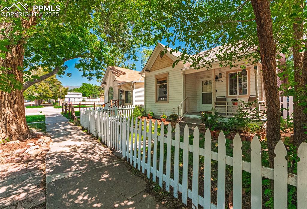 Image 34 of 36: View of front of property with a fenced front yard