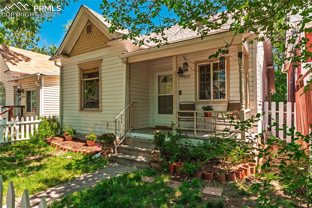 Image 35 of 36: View of front facade with covered porch