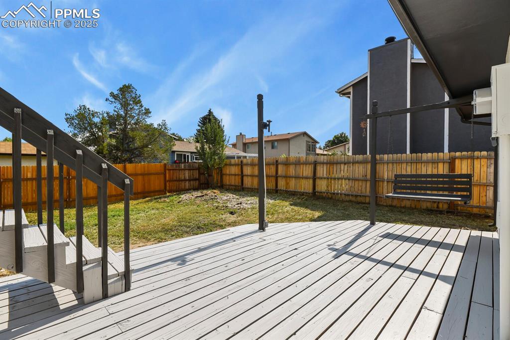 Image 34 of 39: Deck featuring a fenced backyard and a residential view