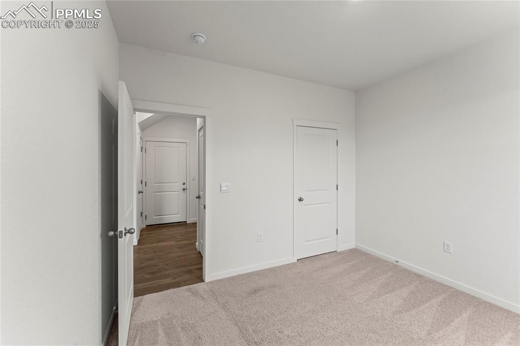 Image 14 of 44: main level bedroom