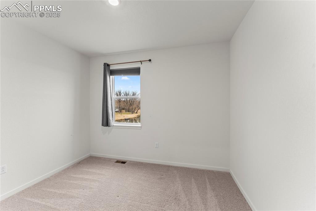 Image 15 of 44: main level bedroom