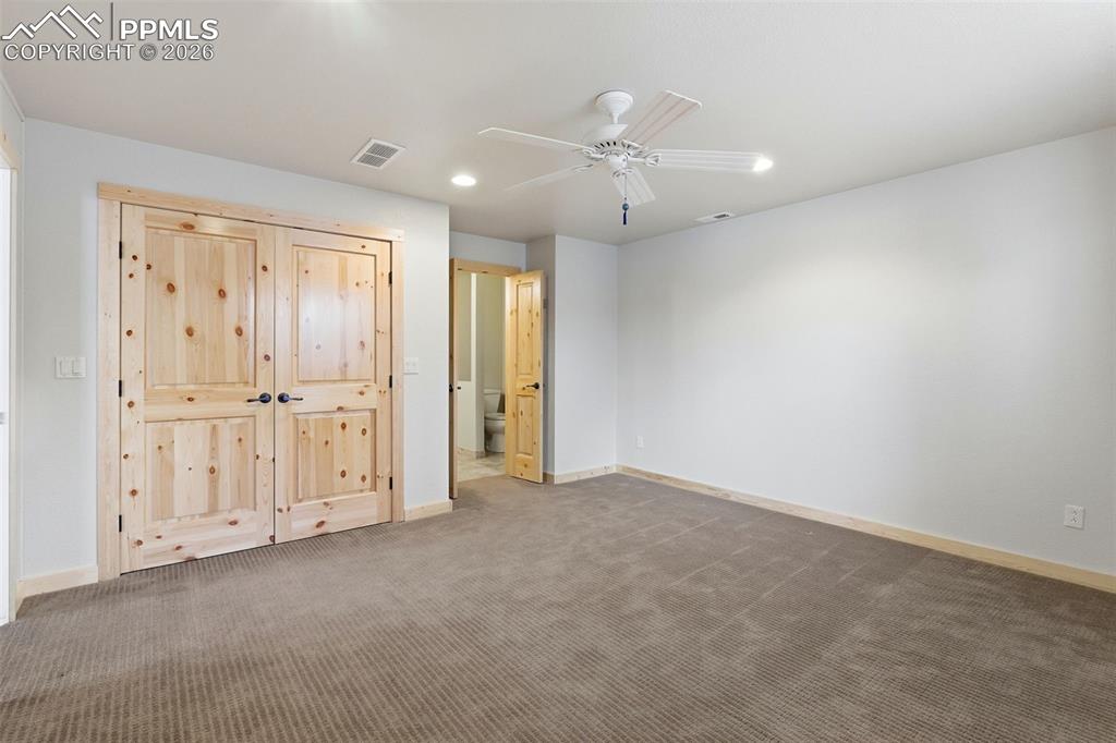 Image 28 of 50: Unfurnished bedroom with carpet, recessed lighting, a ceiling fan, a closet