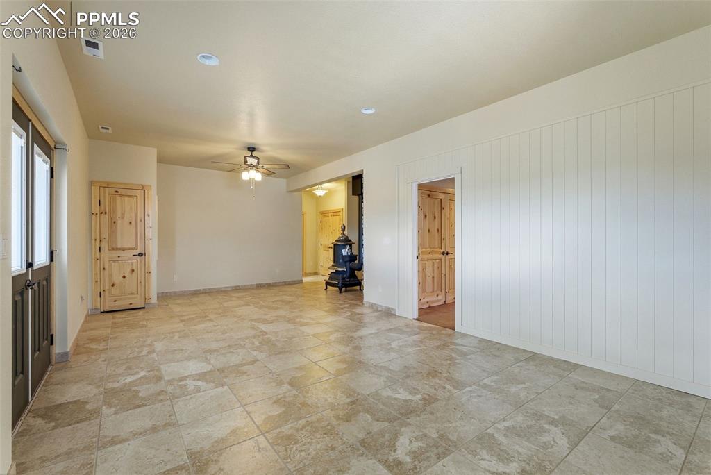 Image 34 of 50: Spare room with ceiling fan and baseboards