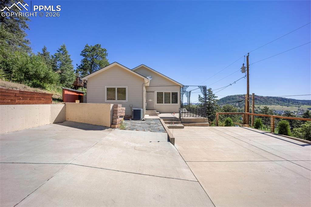 Image 41 of 50: Rear view of house featuring a patio area and a mountain view
