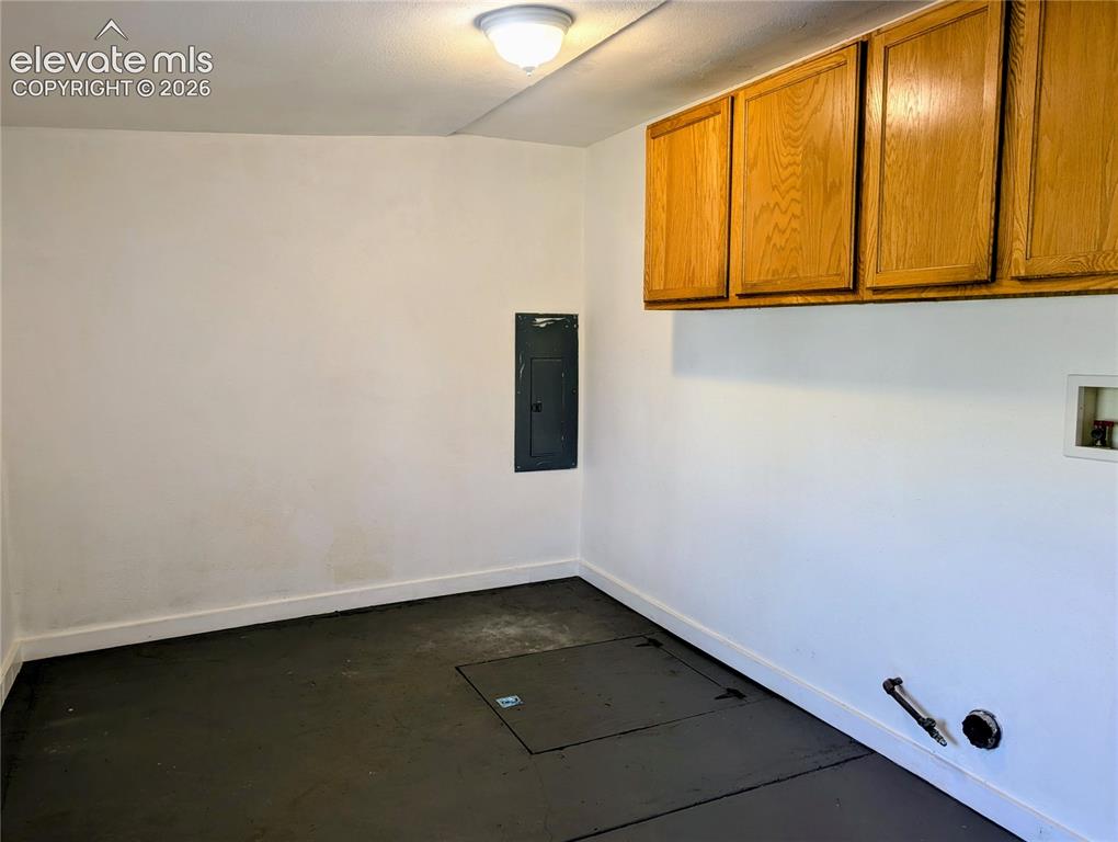 Image 10 of 39: Laundy with overhead cabinets