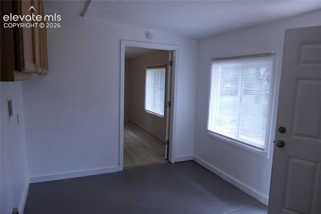 Image 11 of 39: Laundry looking towards dinning room