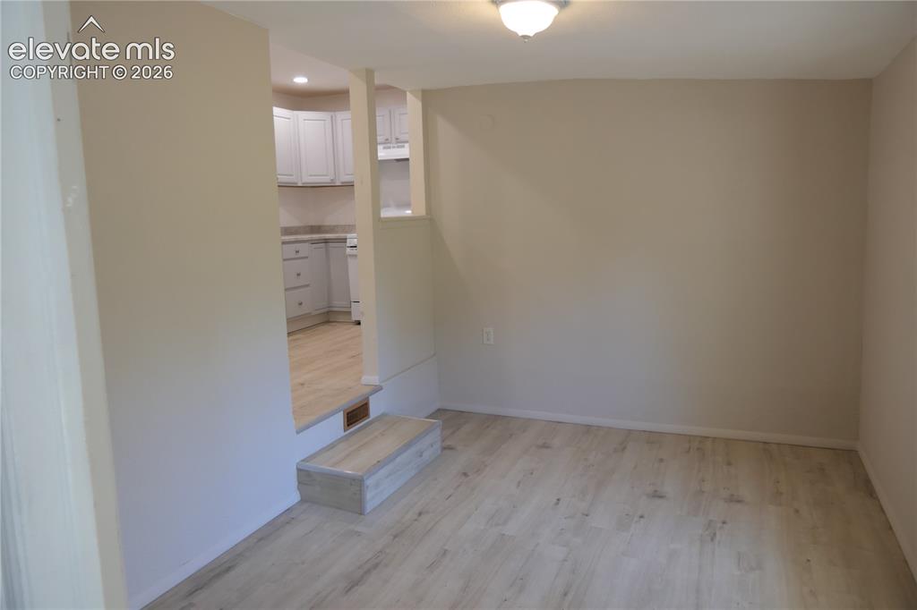 Image 14 of 39: Dining room looking towards kitchen
