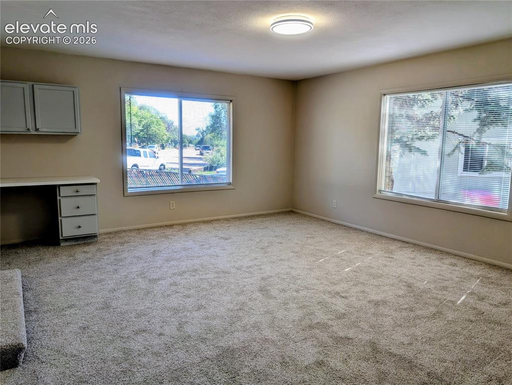 Image 16 of 39: Family room with work station