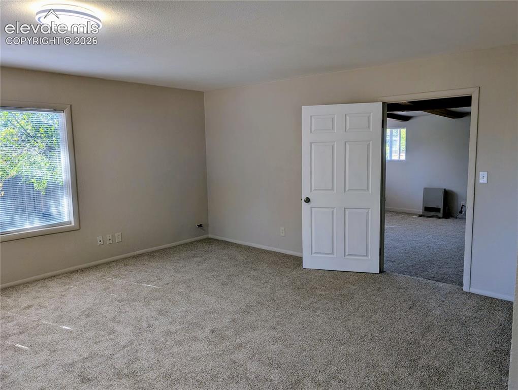 Image 17 of 39: Family room looking towards primary bedroom