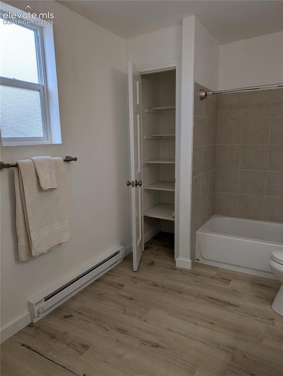Image 24 of 39: Primary bath with linen closet
