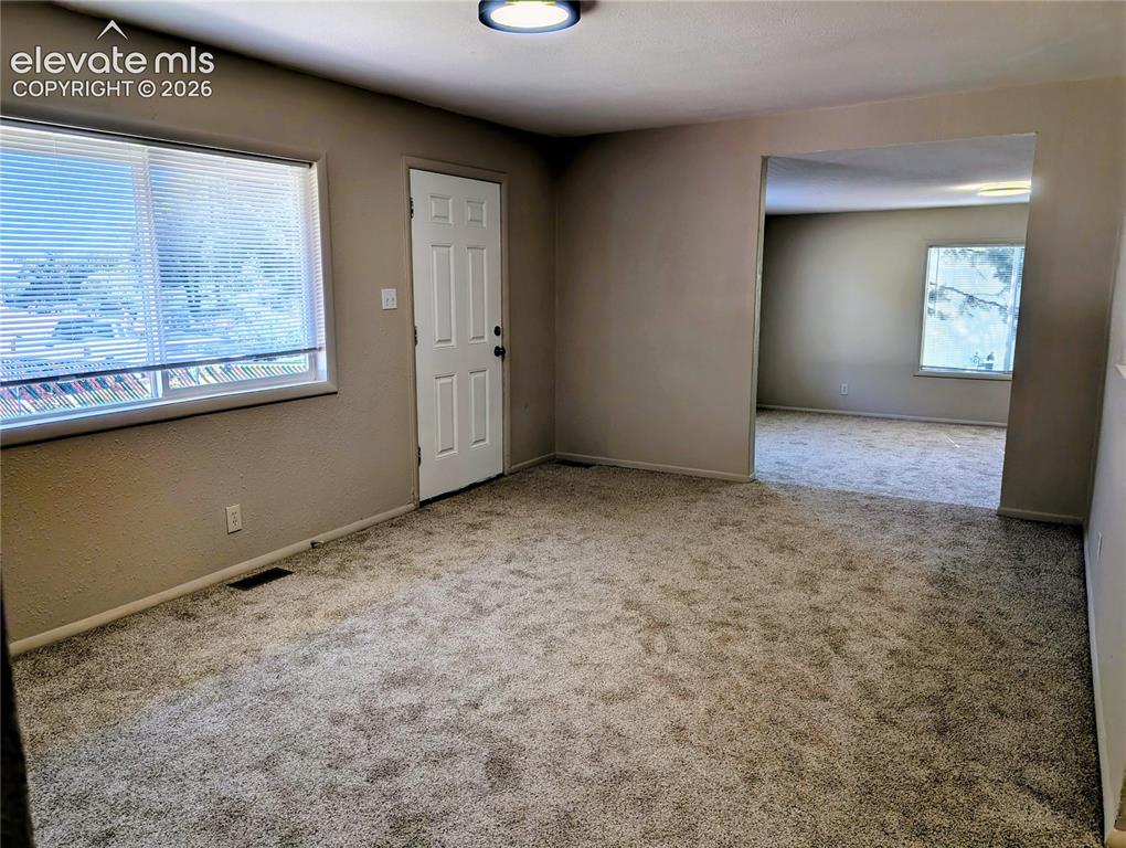 Image 4 of 39: Living room with entry