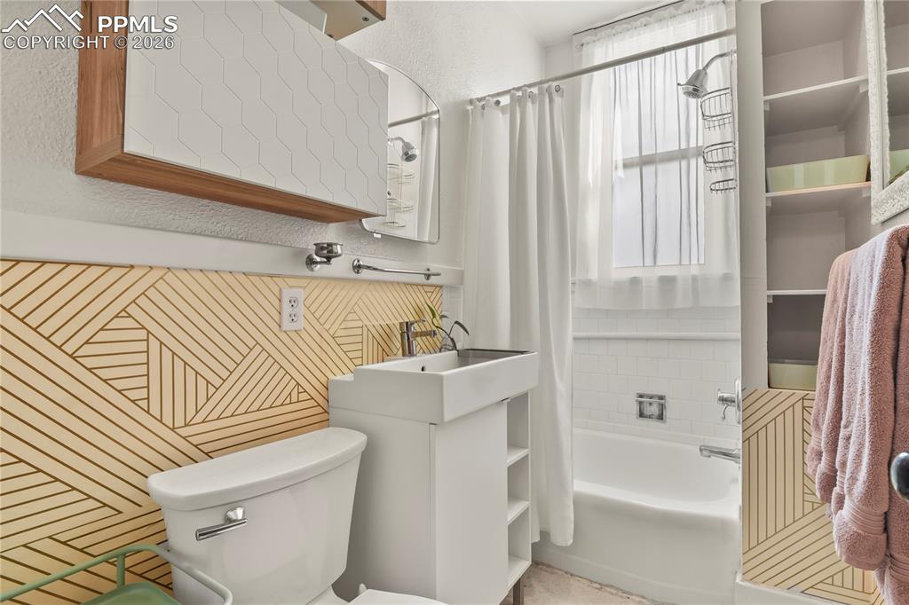 Image 16 of 37: Main level full bath tastefully refreshed