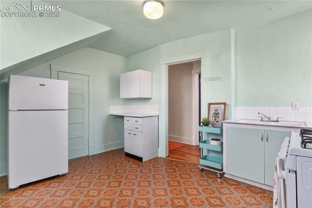 Image 24 of 37: 2nd kitchen upstairs