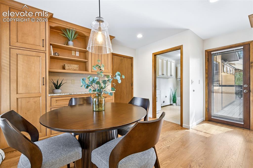Image 14 of 49: …and has coffee bar and cabinets and access to garage, laundry and second d