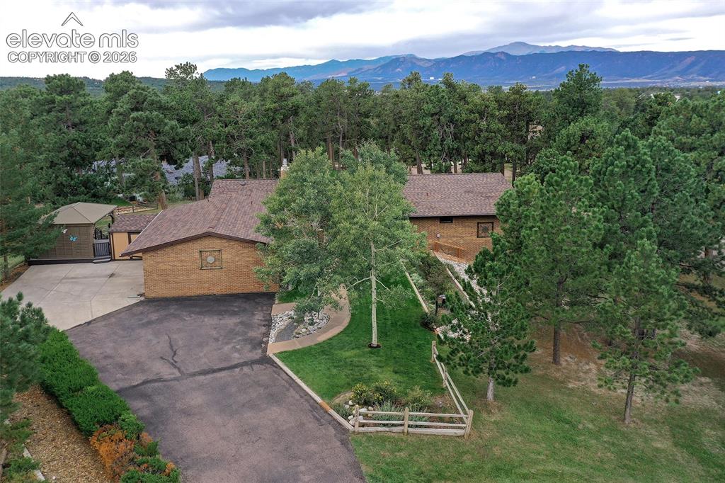 Image 2 of 49: With beautiful mountain views through the trees