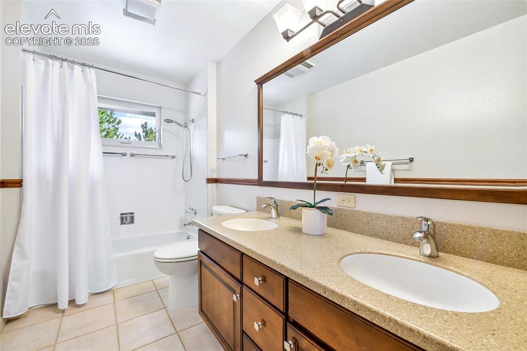 Image 23 of 49: Main level full bath with transom window