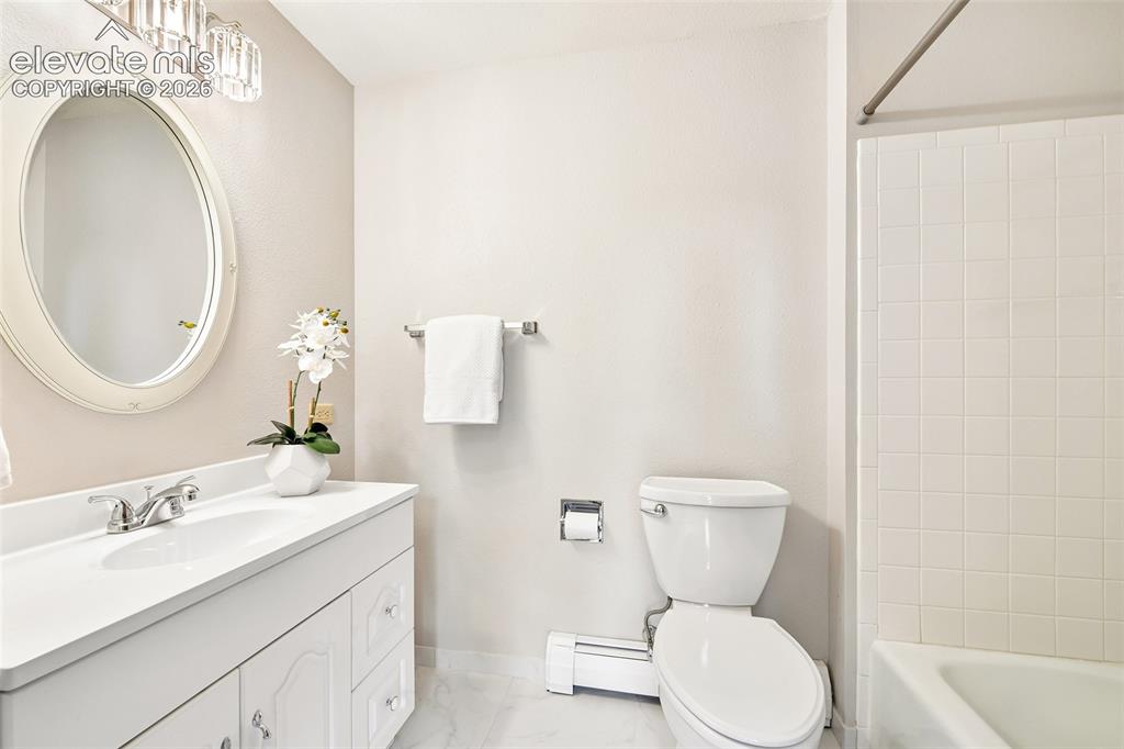 Image 37 of 49: Full bath of fourth bedroom on lower level