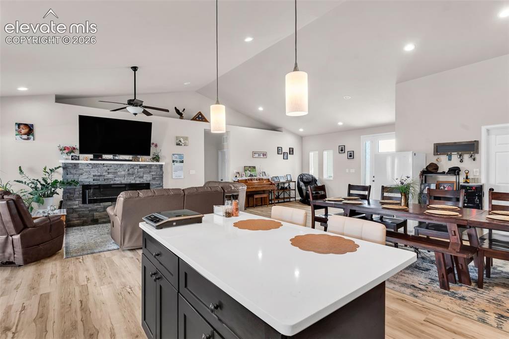 Image 17 of 49: Spacious open-concept interior featuring light-toned walls and wood-finish