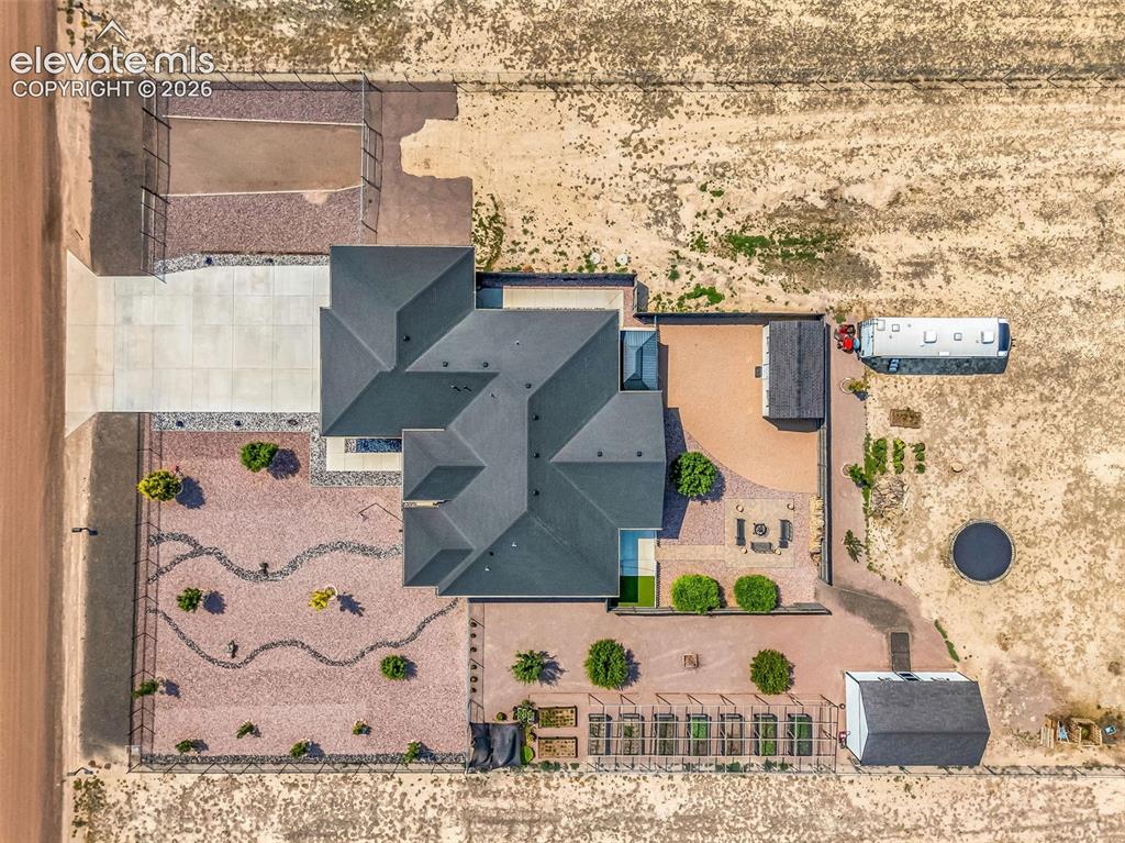 Image 48 of 49: Expansive property featuring a multi-gabled main residence, a paved drivewa