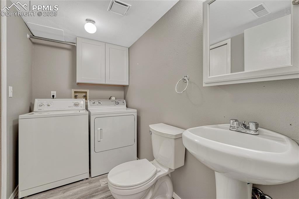 Image 39 of 50: Laundry/Powder Room Combo in Lower Level