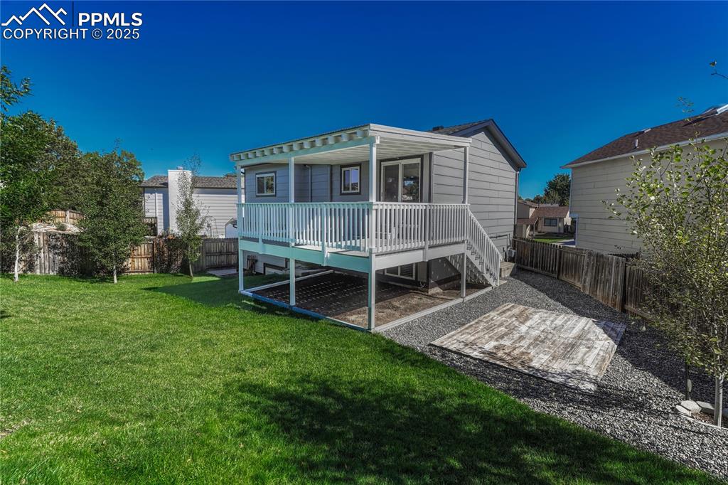 Image 45 of 50: Backyard Access from Deck